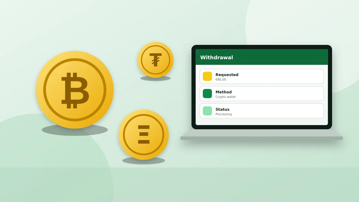 Cryptocurrency coins beside a laptop showing a withdrawal in progress